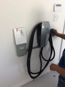 Electrician installing electric charger