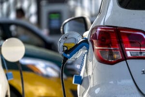Electric vehicle charging in charging station